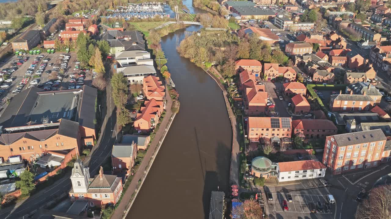 Newark on Trent town center from above featuring residential areas, commercial buildings, riverside properties along the River Trent, and the historic canal system in Nottinghamshire, England