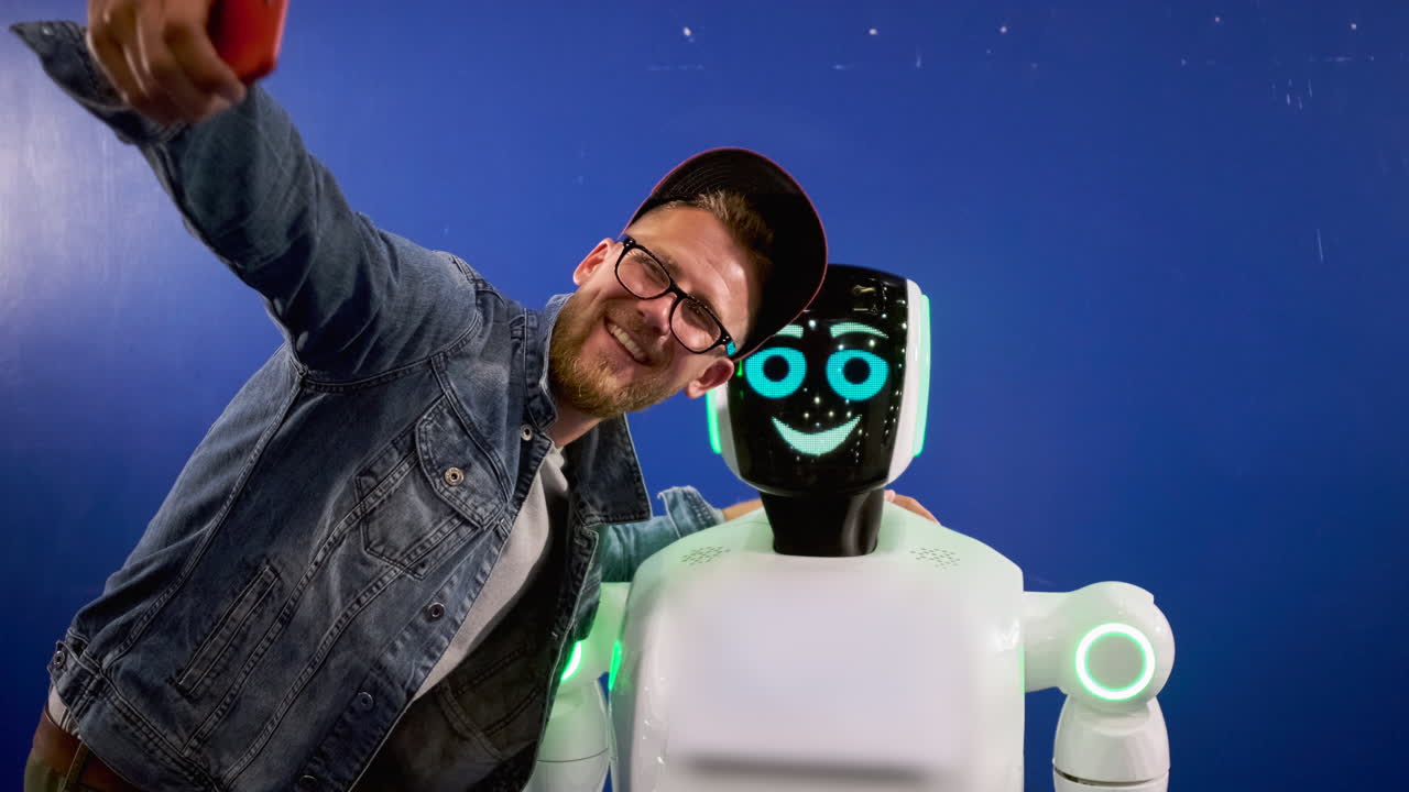 Man taking a selfie with a robot