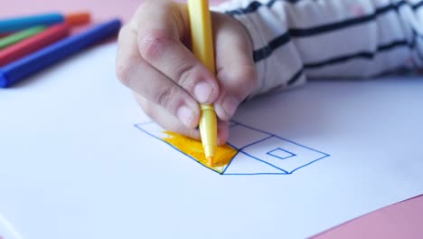 child girl drawing on paper sitting on floor