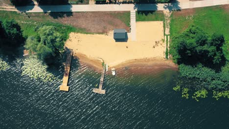 epic top down aerial view of big lake with clear blue water