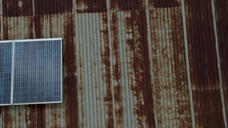 Sustainable-energy-in-Loitokitok-kenya-Africa-drone-view-of-the-rusted-roof-with-the-solar-energy:-Alternative-energy-source-In-kenya-Africa