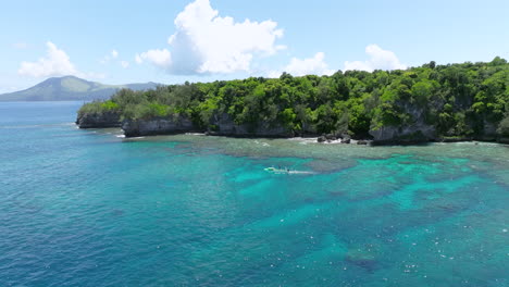 Boating-Around-Vegetated-Island-Of-Moso-In-Efate,-Vanuatu,-Melanesia