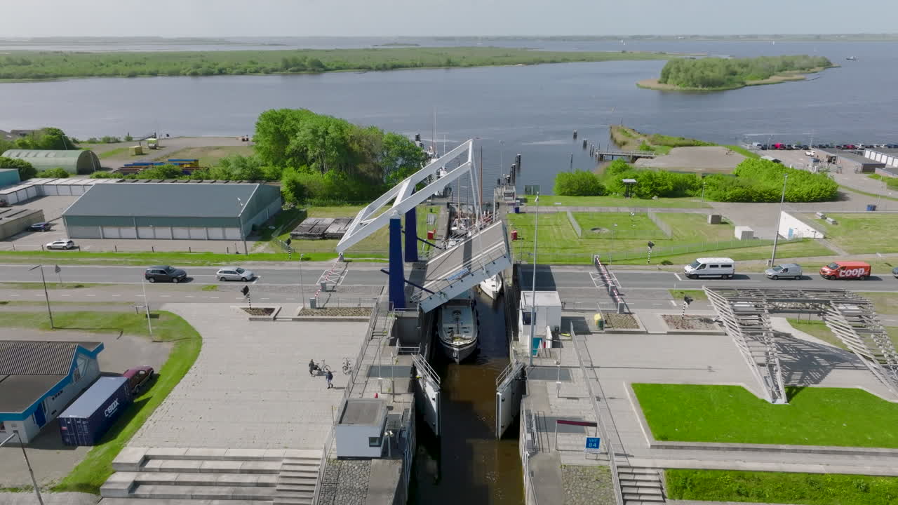 The Dutch port of Lauwersoog is equipped with a gate that is opened to allow boats access to the port