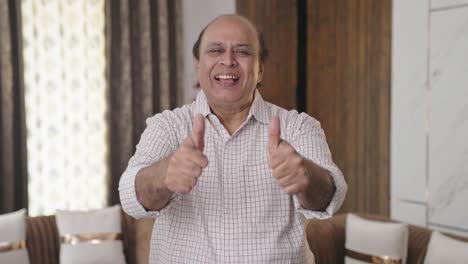 indian old uncle showing thumbs up