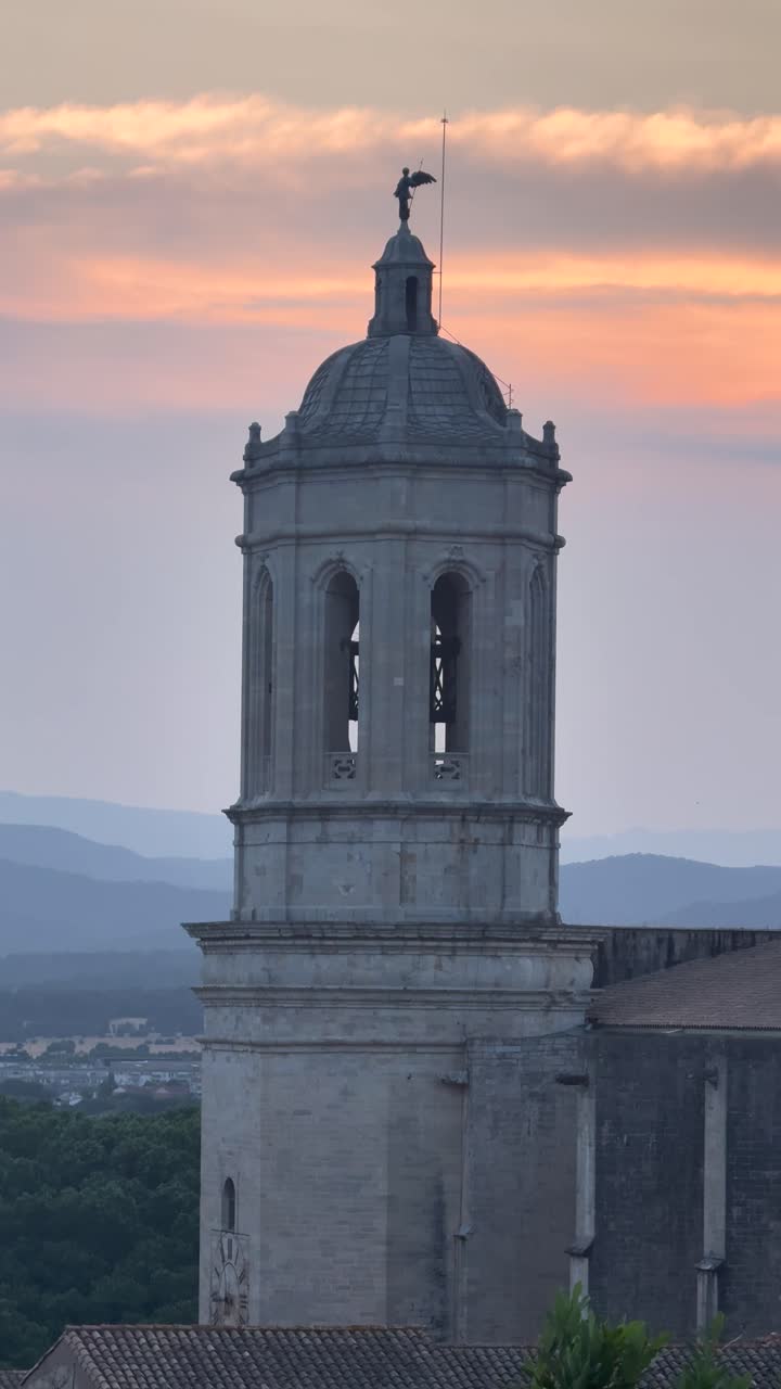 Girona Cathedral tower close-up at sunset, evoking tranquility and history