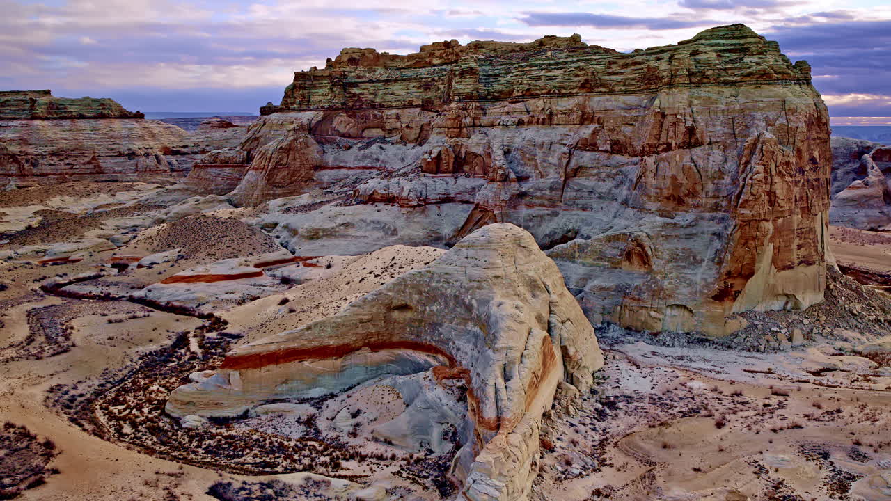A stunning drone perspective revealing the unique and dramatic desert terrain surrounding Lake Powell.