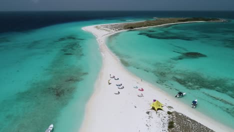 awning, boats and kite surfers