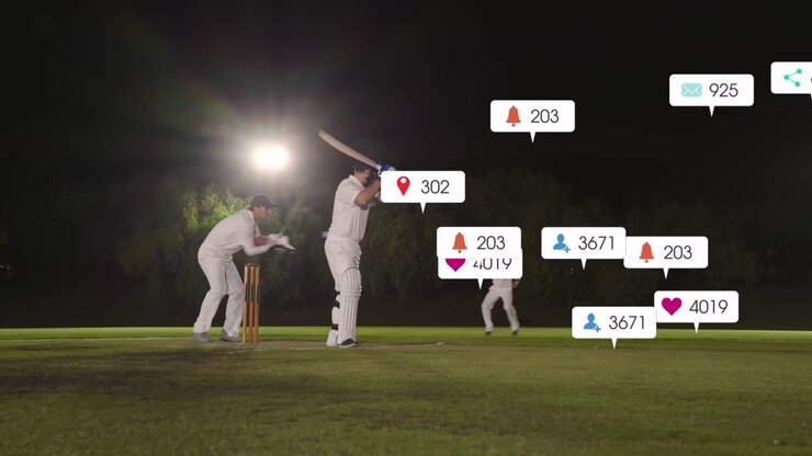 Lanciatore di cricket che corre, battitore che colpisce alla linea di battuta sotto le luci, icone social che appaiono per i 'mi piace'.