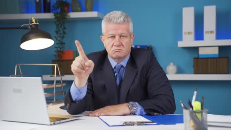 businessman looking at camera angry and aggressive.