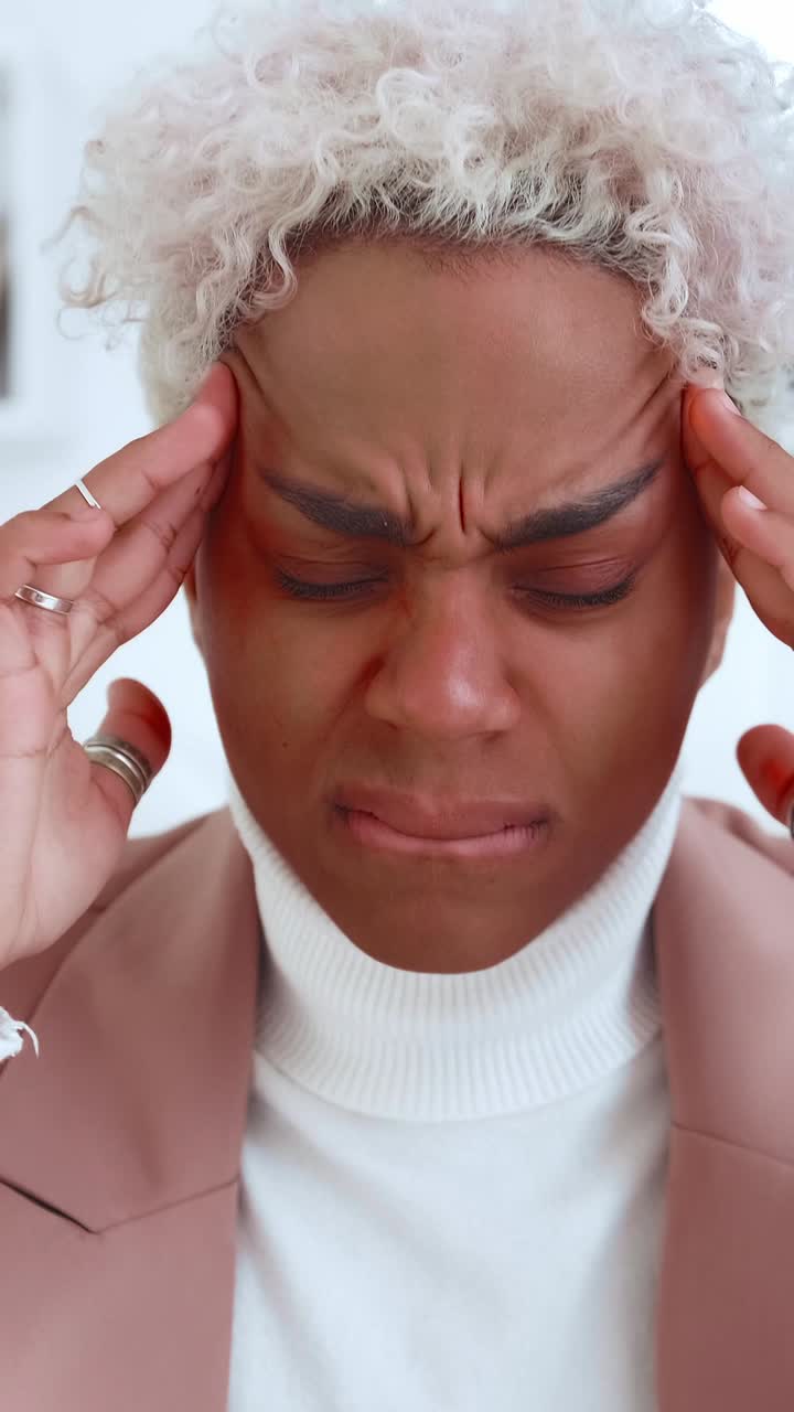 Woman experiencing headache and stress