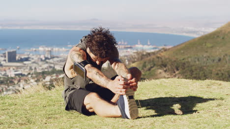 a young man stretching before a run outdoors