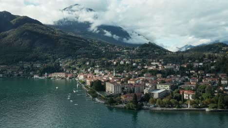 AERIAL:-Little-Town-of-Menaggio-with-Cloudy-Mountains-in-Background