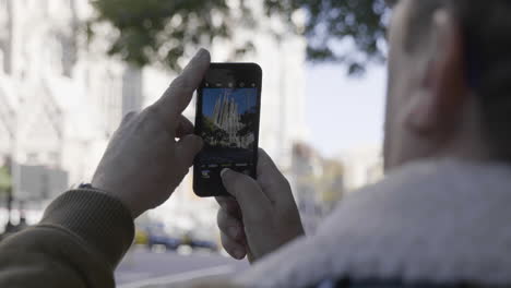 taking a picture of sagrada familia in barcelona
