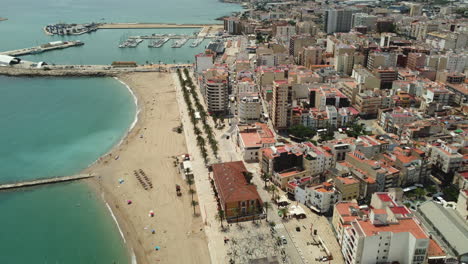 coastal cityscape with beach and harbor