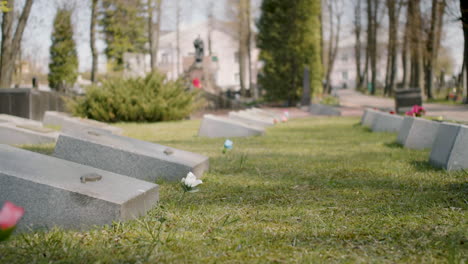 Zoom-In-Of-A-Graveyard-With-Tombstones-In-An-Urban-Area-On-A-Sunny-Day-2