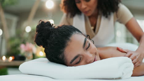 woman receiving a relaxing massage at a spa
