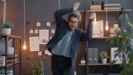 happy employee dancing in the office