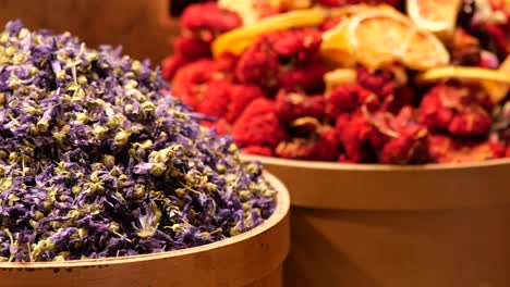 dried flower tea in wooden bowl