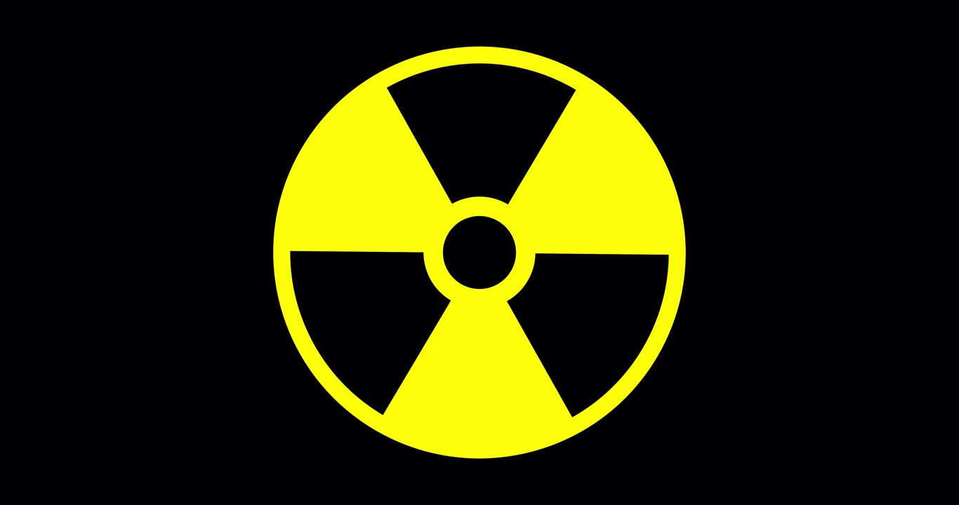 Símbolo animado de advertencia de radiación con efecto parpadeante sobre un fondo transparente. Trébol negro sobre círculo amarillo que parpadea para indicar peligro radiactivo, alerta de seguridad y advertencia de riesgo nuclear