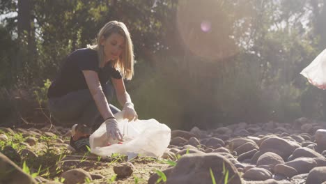 mid adults volunteering during river clean-up day