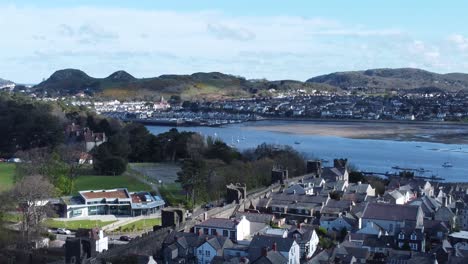 welsh holiday cottages enclosed in conwy castle battlements stone walls aerial view along harbour