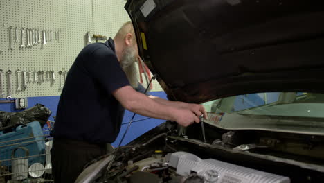professional car mechanic working in auto repair service