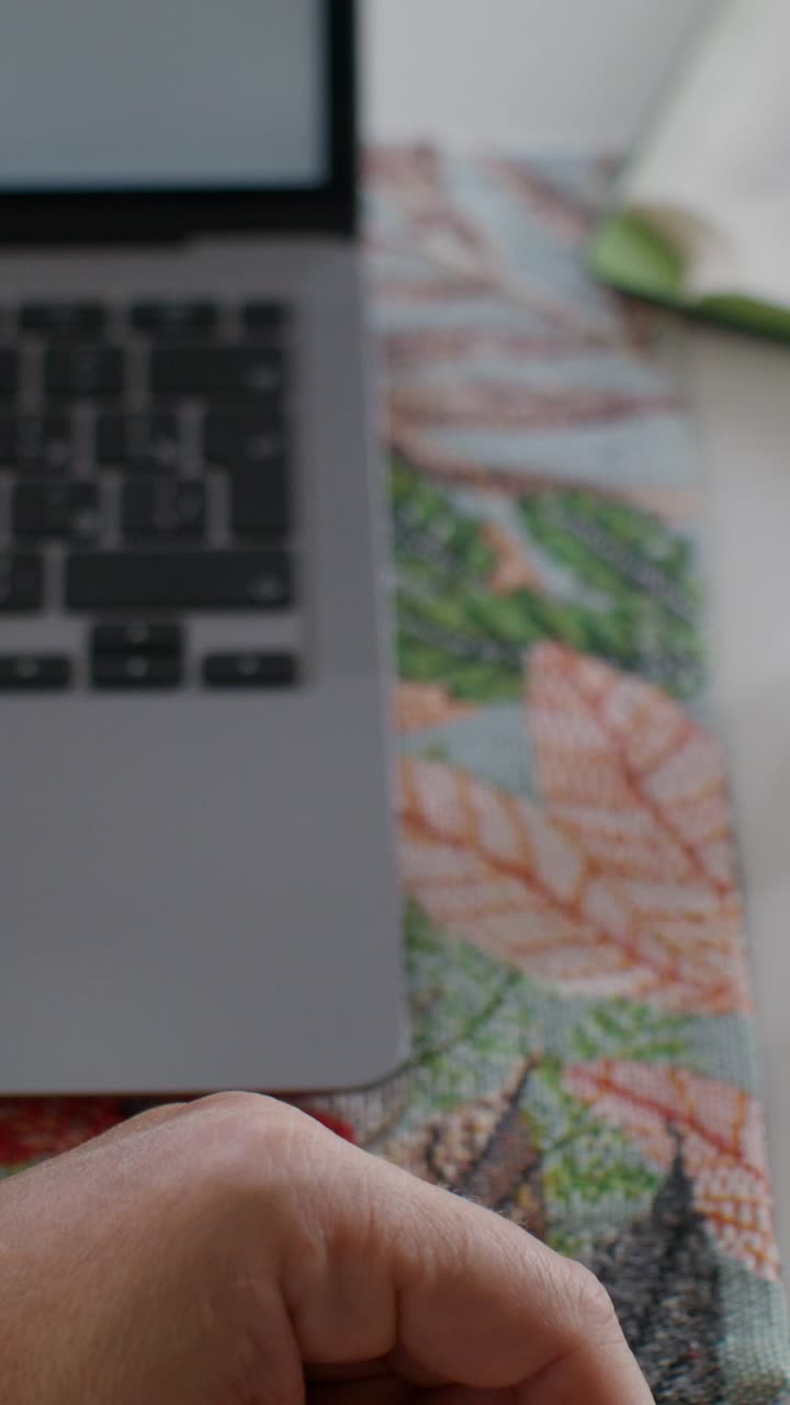 Person taking medication from a bottle