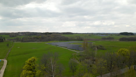 lift up reveal of rural solar farm near the town of pieszkowo poland