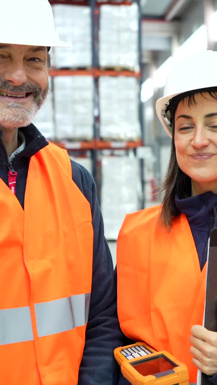 Warehouse workers in safety gear