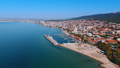 Flight over the blue waterscape of the Black Sea near Sveti Vlas, Bulgaria. Resort city with beautiful beaches and green mountains. Aerial view