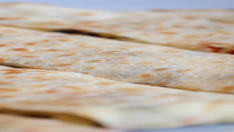 close-up of a stack of burritos