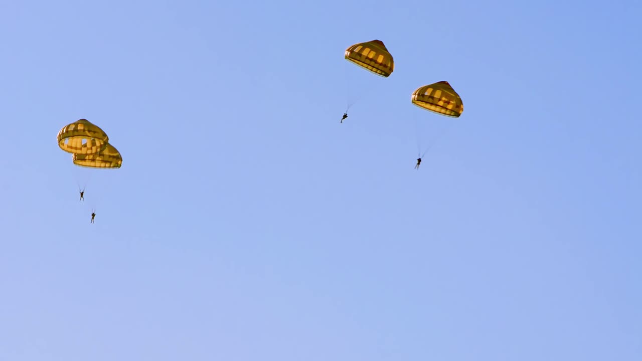 Paratroopers Jumping from a Military Airplane