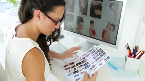 cute businesswoman working with pictures