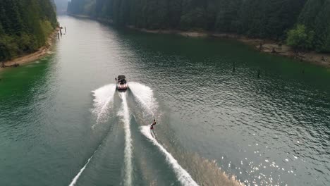 Man-wakeboarding-with-motorboat-in-the-river-4k