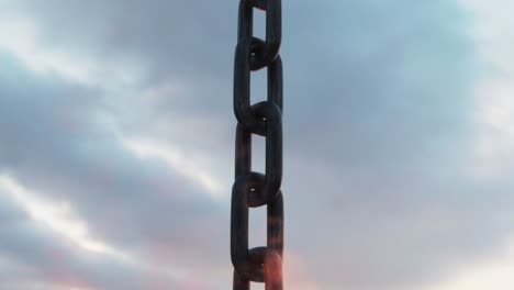 Aerial-footage-of-a-chain-surrounded-by-ocean-waves-at-sunset,-with-a-sweeping-camera-view-towards-the-sky,-symbolizing-the-concept-of-global-logistics-and-transportation