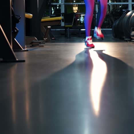 jumping rope. athletic woman training hard at the gym.
