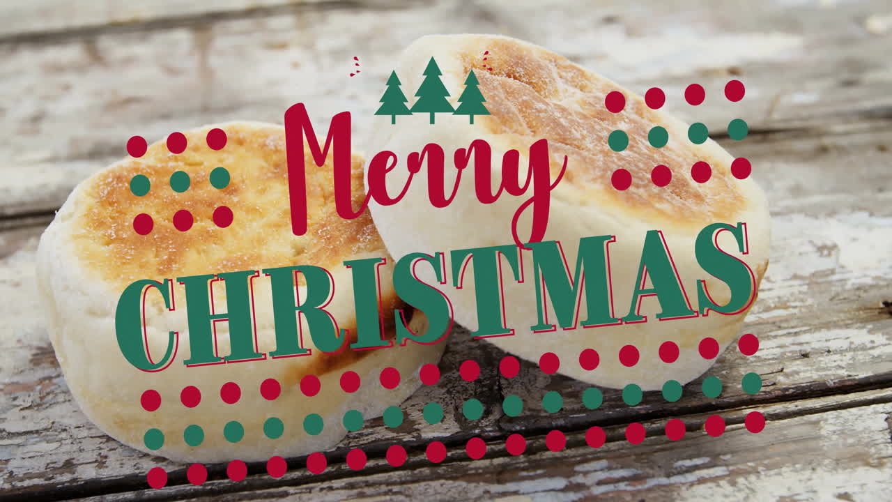 Festive decorations with Merry Christmas text over toasted muffins on rustic wood