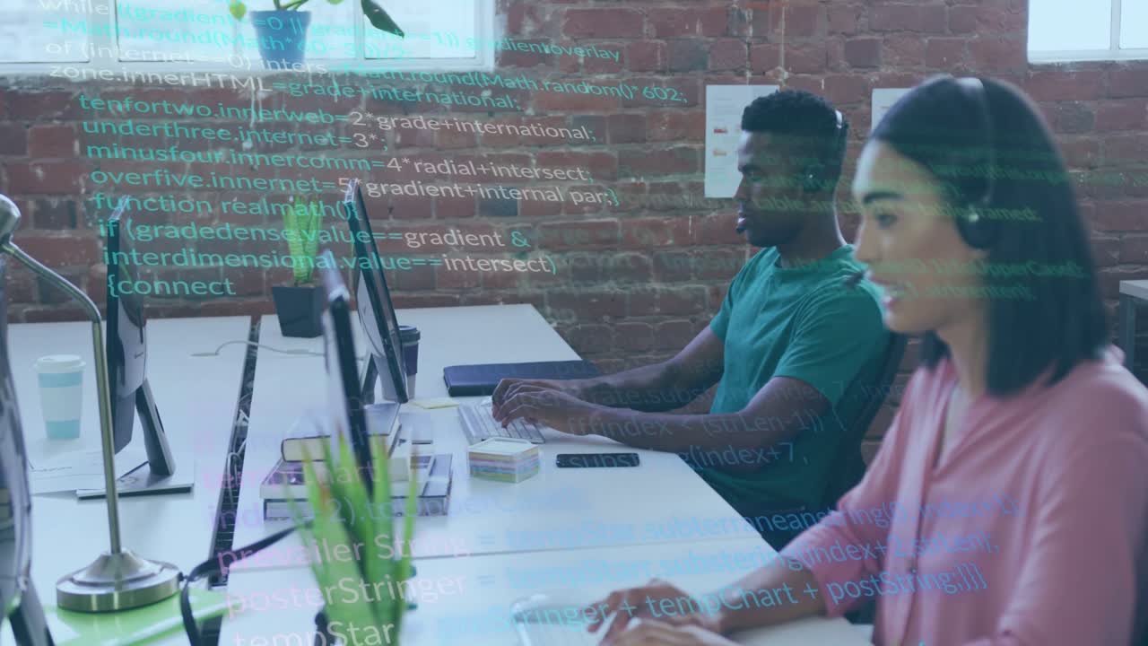 Coworkers typing at tech desk woman speaking into headset causing green code overlay showing data