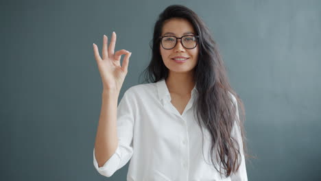 woman giving an ok sign
