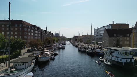 Aerial-Descent-Canal-with-Kayakers,-Copenhagen-Denmark