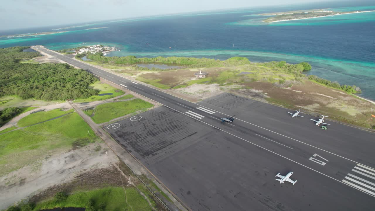 Aerial view of planes on a runway near Los Roques beaches
