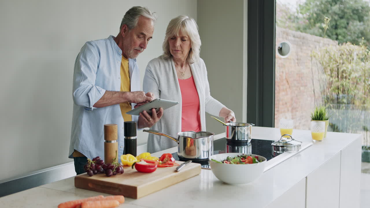 Older couple cooking together in the kitchen
