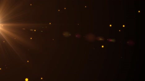 animación de múltiples focos amarillos brillantes que se mueven sobre un fondo negro