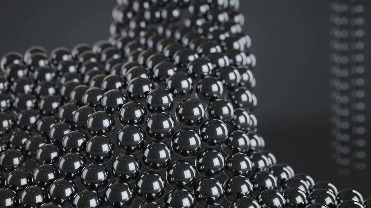 Camera pulling back revealing glossy black spheres forming curved wave in studio with tall columns