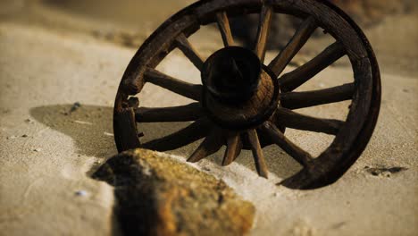 Large-wooden-wheel-in-the-sand