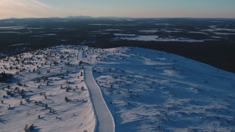 Stunning-aerial-shot-of-ski-pistes-on-Levi-mountain,-Finland