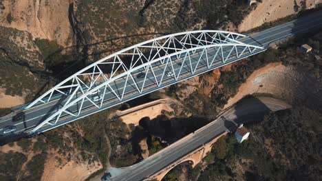 Aerial-view-of-a-modern-bridge-on-top-of-another-two-older-bridges-from-different-periods