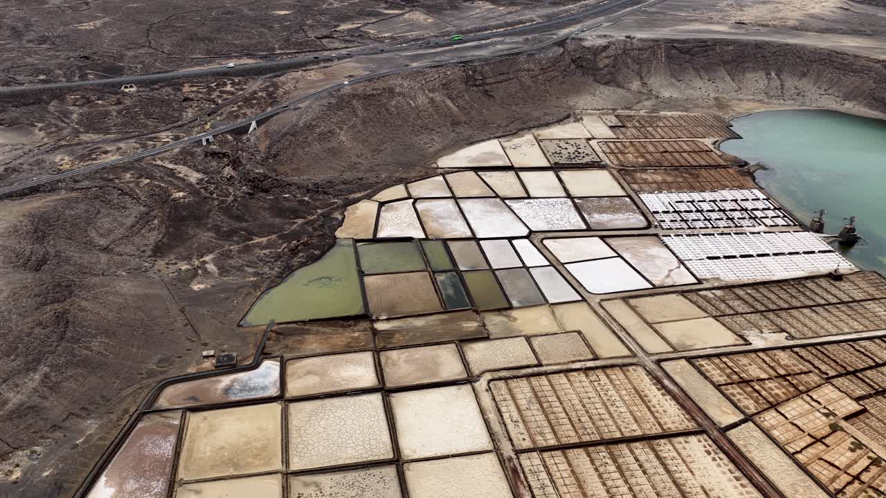 Salinas de Janubio salt flats aerial view establishing the volcanic lagoon grid and mining formation