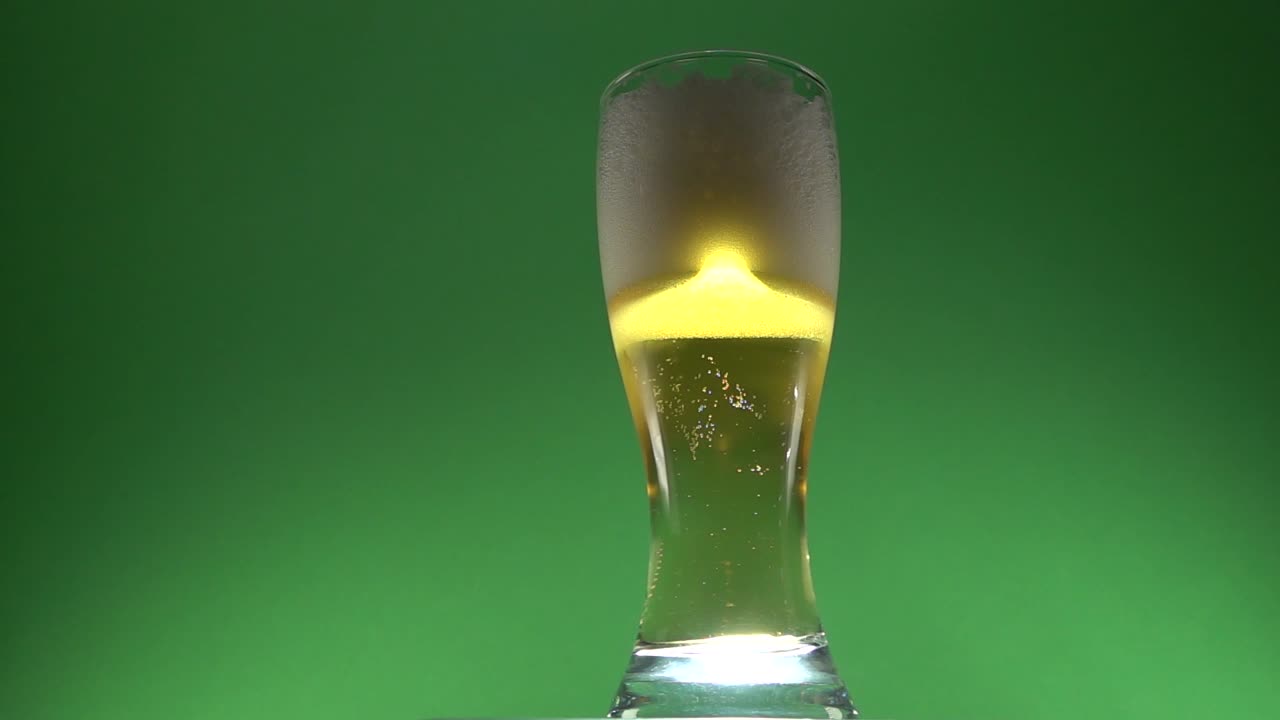 Beer foam rising on a glass