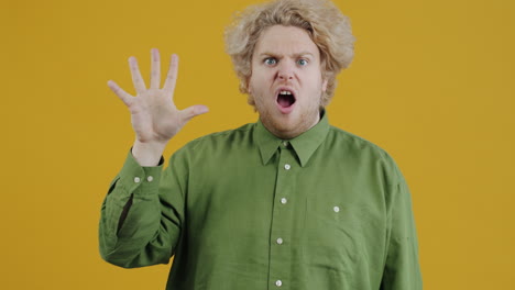 man counting with hand gestures